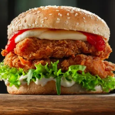 Crispy chicken fillet burger with lettuce and mayo