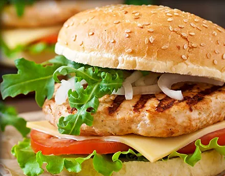 BBQ chicken burger with cheese, tomato and lettuce